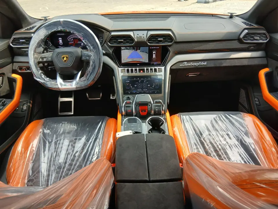 Lamborghini Urus orange interior dashboard and cockpit, Lagos rental