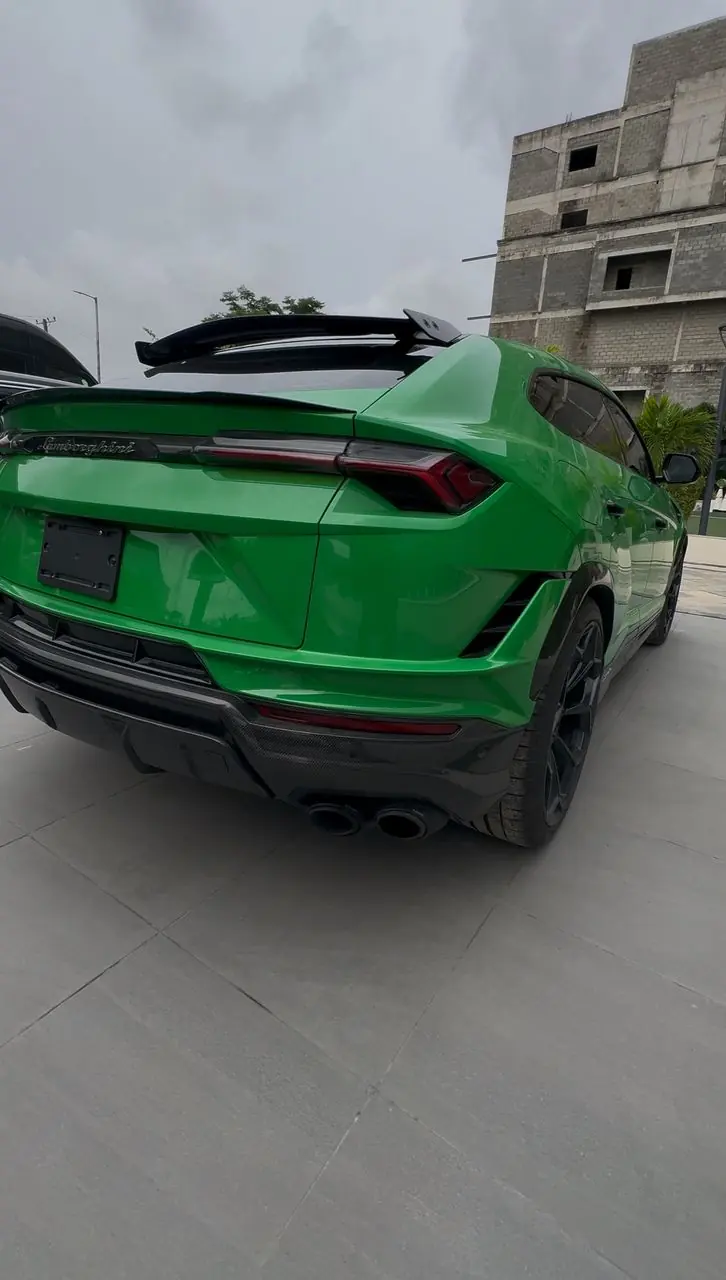 Green Lamborghini Urus rear three-quarter view, Lagos rental
