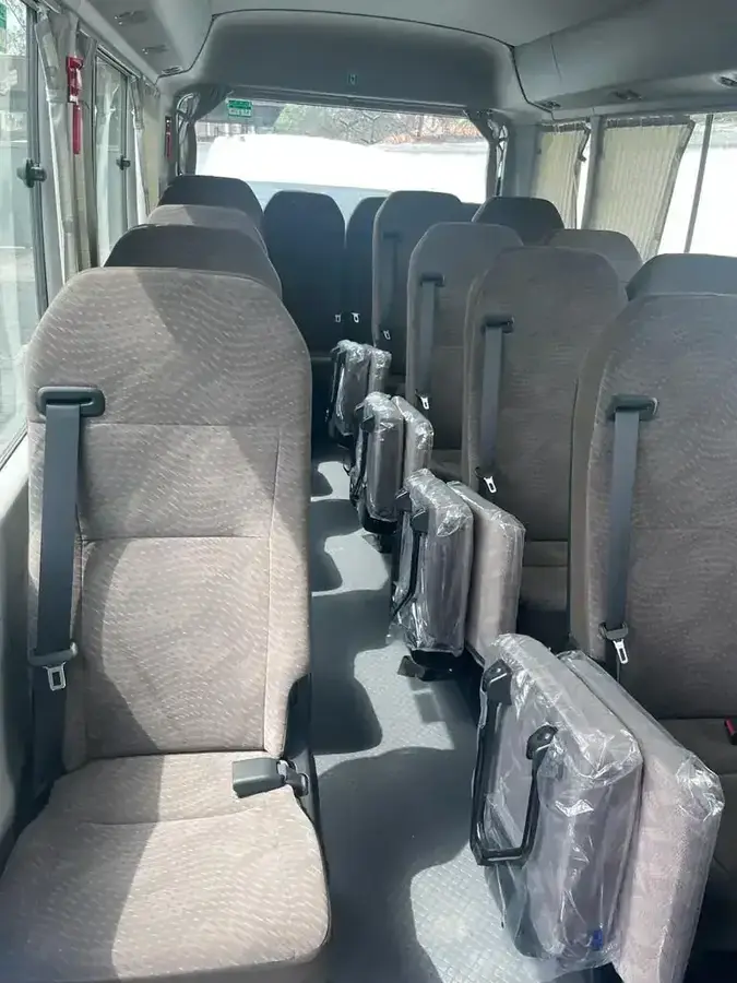 Toyota Coaster bus interior available for group hire in Lagos